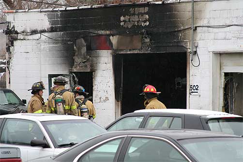 Palatine Fire Department firefighters at Expert Auto Repair Fire