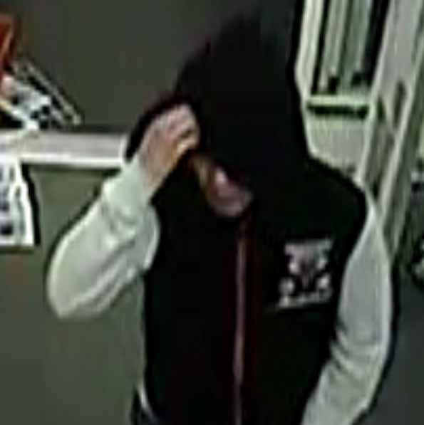 CVS robbery suspect black Bulls hoodie with white sleeves.