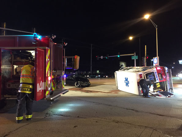 Arlington Heights Engine 4 at a private ambulance rollover crash at Dundee Road and Arlington Heights Road in District 4