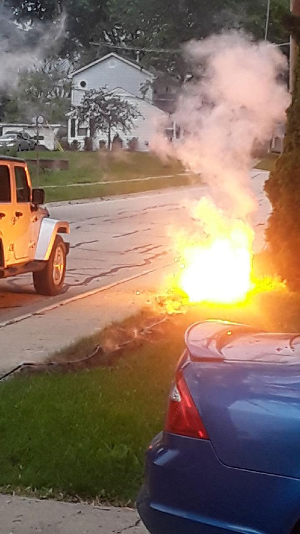 Power line, arcing, flaming up with gas-fed fire