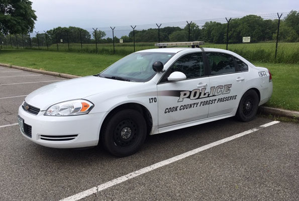 Cook County Forest Preserves Police squad car at Busse Woods during investigation of attack of Arlington Heights man