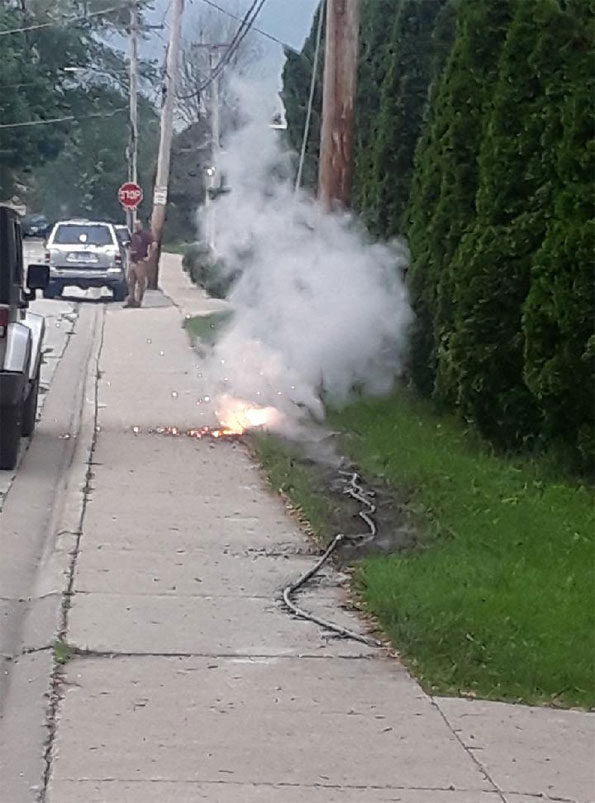 Downed power line arcing and smoking
