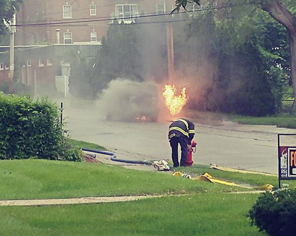 Jeep smoking before igniting from radiant heat of nearby gas-fed fire