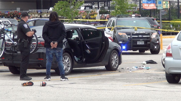 Male in handcuffs at Rolling Meadows shooting scene