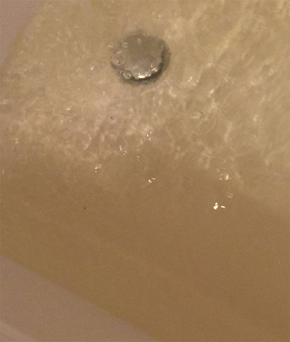 Bathtub water turbidity showing larger particles during Arlington Heights water main break