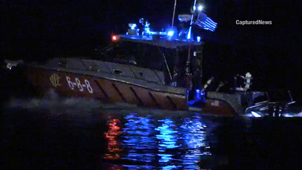 Chicago Fire Department Fast Boat 6-8-8 rushing victim to Belmont Harbor dock after boat capsized