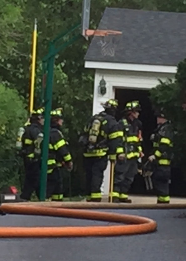 Firefighters at small detached garage fire Arlington Heights