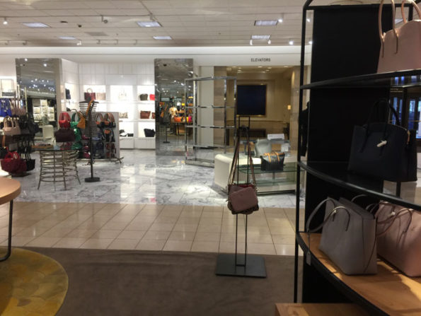 Handbag rack Nordstrom Woodfield where thousands of dollars in handbags taken in Flash Mob Robbery