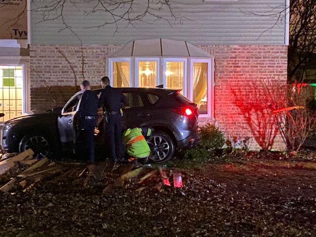 SUV crash against house at Newbury Lane and Grove Street in Scarsdale, Arlington Heights