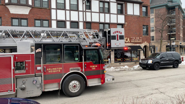 Tower 1’s crew clearing smoke after burnt food initiated a smoke scare and activate the fire alarm at the landmark Vail/Davis Building