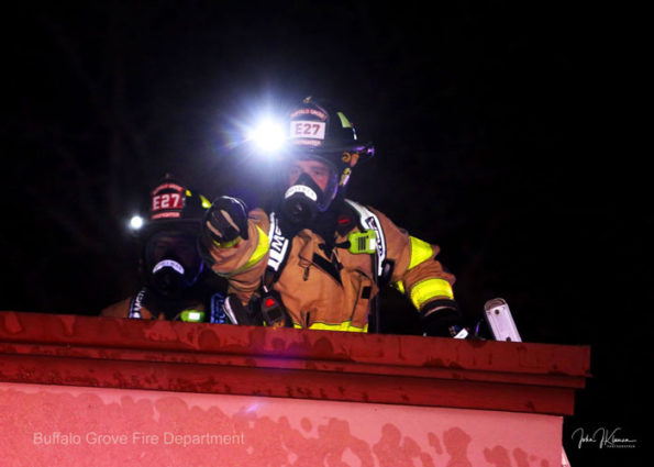 Buffalo Grove firefighters with headlamps on the roof (SOURCE: BGFD/J Kleeman)