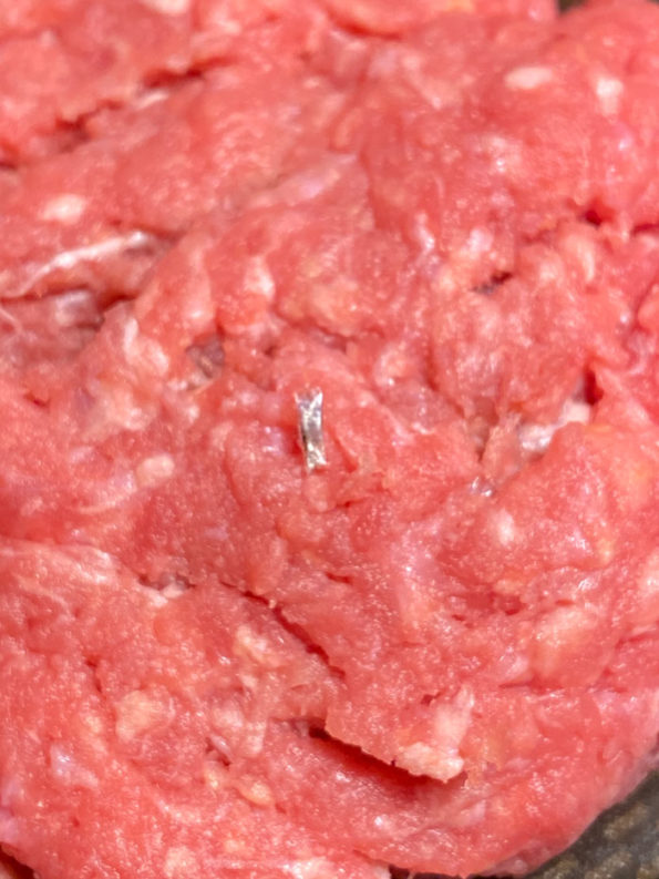 View of foreign object In ground sirloin sold at Mariano's