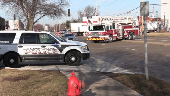 Elk Grove Village Fire Department ladder truck crew working at the truck crash that ruptured a gas line