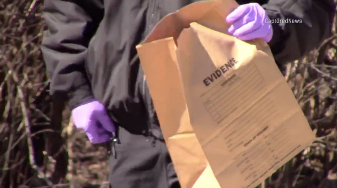 Evidence Bag with forensics investigators at the crime scene on Old Sutton Road Barrington Hills on Saturday, March 7, 2020