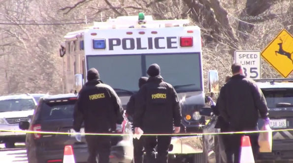 Forensics investigators return to the MCAT van at the crime scene on Old Sutton Road Barrington Hills on Saturday, March 7, 2020