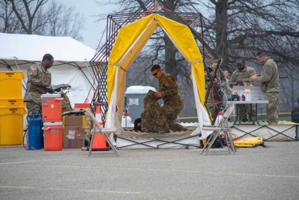 Pennsylvania Air National Guardsmen set up gear at a mass coronavirus test center in Upper Dublin Township, Pa., March 20, 2020. Approximately 80 members worked with local, state and federal authorities to open the drive-thru testing location