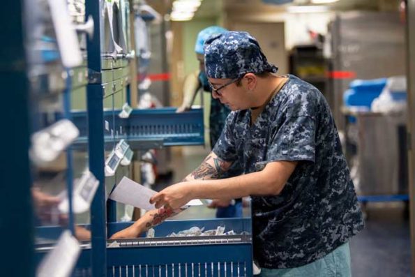 Corpsmen inventory medical supplies aboard the Navy hospital ship USNS Mercy in San Diego, March 30, 2020