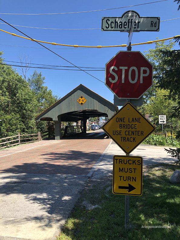 Sign on the southwest side of the covered bridge advised to use center tracks; there is no center track advisory on the northeast side of the bridge