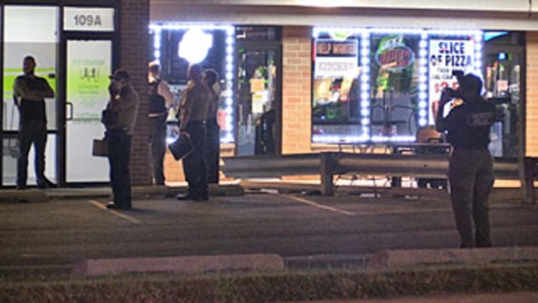 Cook County Sheriff's Office deputies and investigators on scene at Junior's Place bar in strip mall on Grand Avenue near Wolf Road