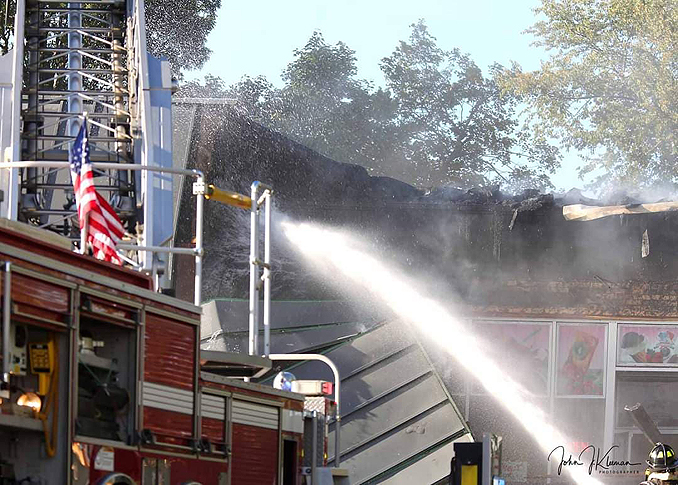 Exterior washdown at strip mall fire in Mundelein Wednesday, September 2, 2020 (PHOTO CREDIT: J. Kleeman)