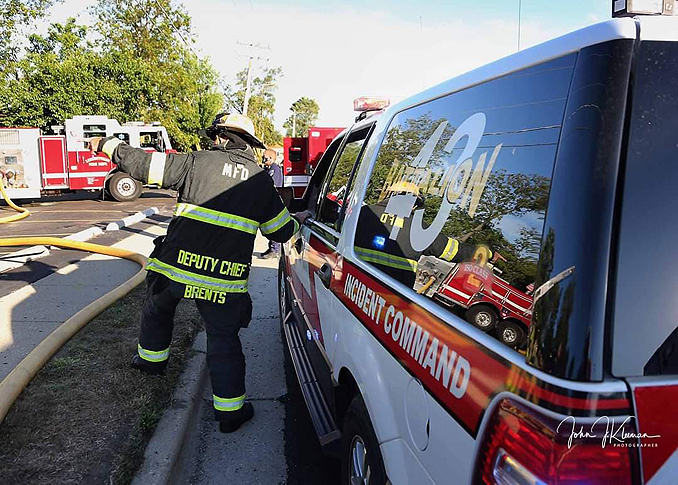 Updating fire command face-to-face at strip mall fire in Mundelein Wednesday, September 2, 2020 (PHOTO CREDIT: J. Kleeman)