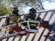 Roof operations with a K-12 circular saw at strip mall fire in Mundelein Wednesday, September 2, 2020 (PHOTO CREDIT: J. Kleeman)