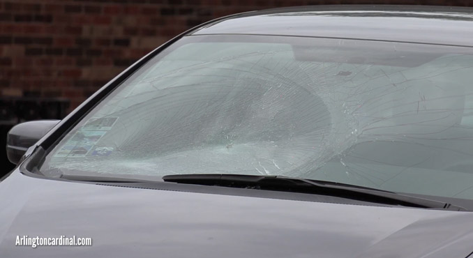 Bicycle vs car crash with damaged windshield on Evergreen Avenue near Sigwalt Street in downtown Arlington Heights