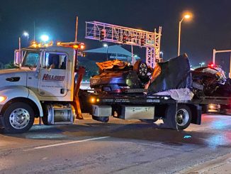 Hillside Towing removes Honda Accord in pieces after crash with utility pole at Northwest Highway and Wilke Road in Arlington Heights