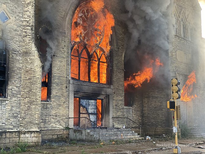 Church fire in Rockford with large flames out of windows and the front entrance on Wednesday, September 2, 2020
