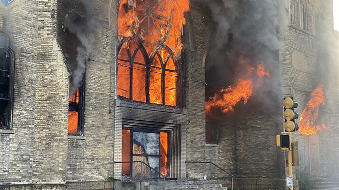 Church fire in Rockford with large flames out of windows and the front entrance on Wednesday, September 2, 2020