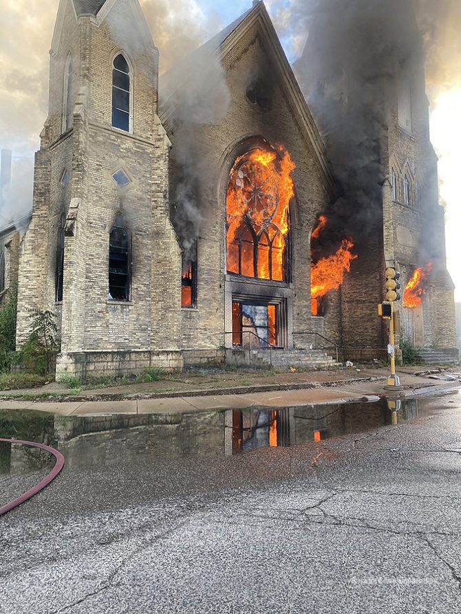 Church fire in Rockford with large flames out of windows and the front entrance on Wednesday, September 2, 2020