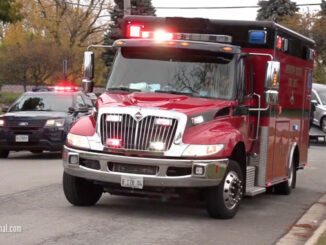 Ambulance leaving crash scene with patient at Northwest Highway (US-14) and Waterman Avenue in Arlington Heights, Illinois