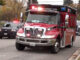Ambulance leaving crash scene with patient at Northwest Highway (US-14) and Waterman Avenue in Arlington Heights, Illinois