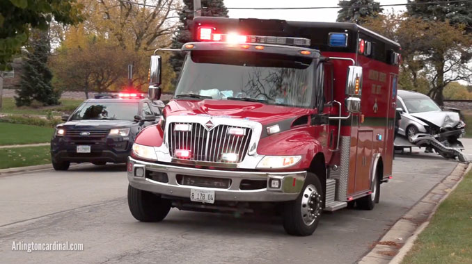 Ambulance leaving crash scene with patient at Northwest Highway (US-14) and Waterman Avenue in Arlington Heights, Illinois