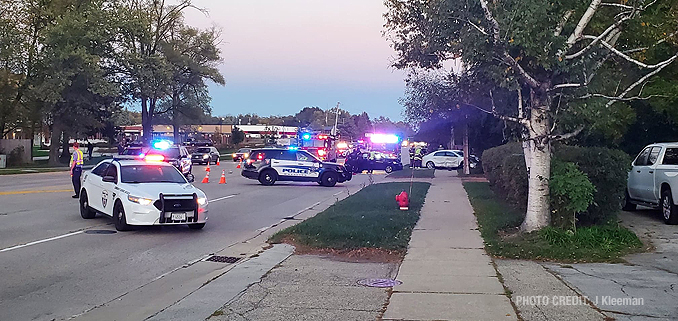 White car over sidewalk at crash on Hintz Road near Mark Lane, Wheeling