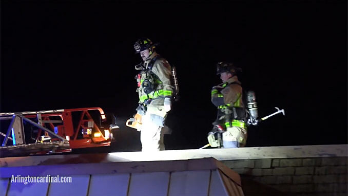 Firefighters coming off roof at condo apartment fire on Kennicott Drive in Arlington Heights on November 4, 2020