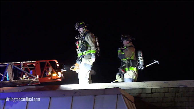 Firefighters coming off roof at condo apartment fire on Kennicott Drive in Arlington Heights on November 4, 2020