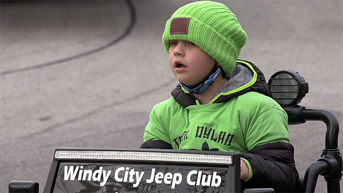 Dylan Schroeder watches for the last vehicles at the end of a fantastic Truck and Vehicle Parade on Sunday, November 29, 2020