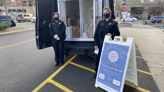 Arlington Heights police officers at collection point for Food and Toy Drive at Jewel-Osco at 122 North Vail Avenue in Arlington Heights