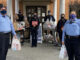 Arlington Heights police personnel with food transport at receiving at the Wheeling Township Food Pantry, 1616 North Arlington Heights for the Food and Toy Drive