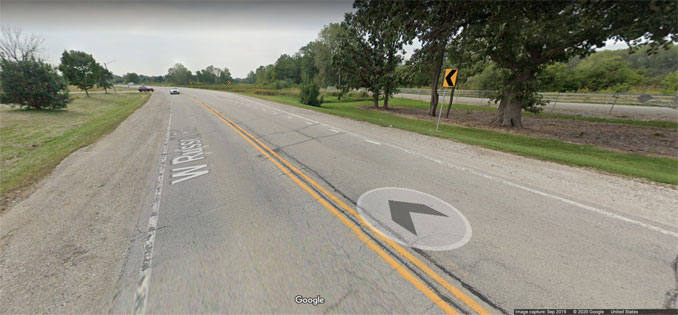 Russell Road banked curve westbound east of Delany Road near the Illinois-Wisconsin state border (Image capture September 2019 ©2020 Google)