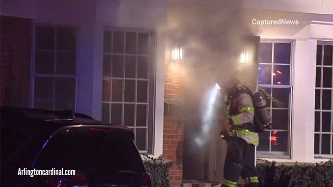 Smoke from front door at house fire in Arlington Heights Smoke from front door at house fire in Arlington Heights