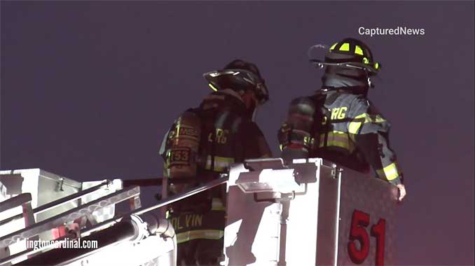 Truck 51 Schaumburg with elevated master stream at auto body shop fire on Morse Avenue in Schaumburg