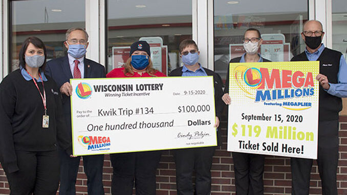 Left to right: Selia Kleine (District Leader at Kwik Trip), Peter Barca (Wisconsin Department of Revenue Secretary), Cindy Polzin (Wisconsin Lottery Director), Jill Ricker (Mount Pleasant Kwik Trip Store Leader), June Schultz (Mount Pleasant Kwik Trip Store Leader), Steve Wrobel (Kwik Trip Public Relations) [SOURCE: Mega Millions]