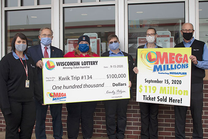 Left to right: Selia Kleine (District Leader at Kwik Trip), Peter Barca (Wisconsin Department of Revenue Secretary), Cindy Polzin (Wisconsin Lottery Director), Jill Ricker (Mount Pleasant Kwik Trip Store Leader), June Schultz (Mount Pleasant Kwik Trip Store Leader), Steve Wrobel (Kwik Trip Public Relations) [SOURCE: Mega Millions]