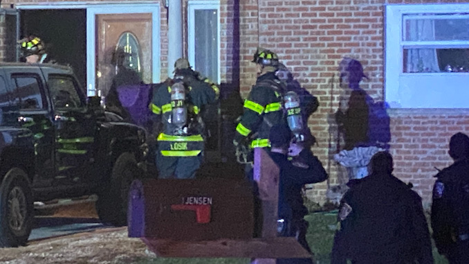 Firefighters at the front of the house Immediately after extinguishing the fire