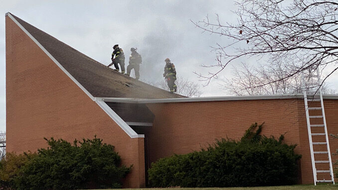 Firefighters working to extinguish a fire at the Christian Church of Arlington Heights at 333 West Thomas St. at the corner of Thomas Street and Chestnut Avenue.