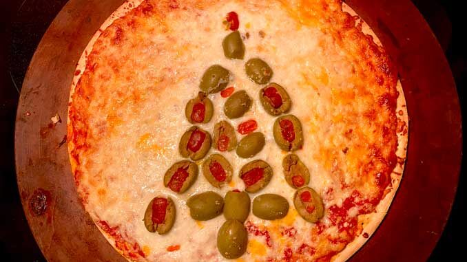 Gino's East Tavern Style Pizza with green olives after baking in the oven