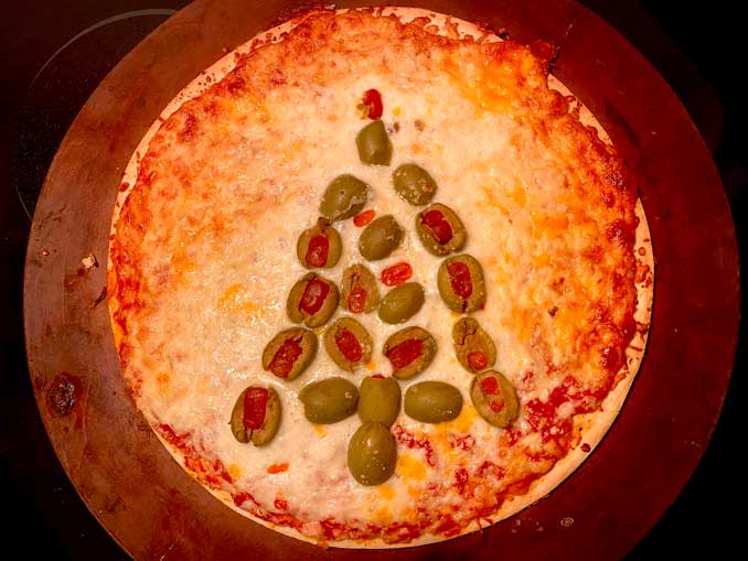 Gino's East Tavern Style Pizza with green olives after baking in the oven