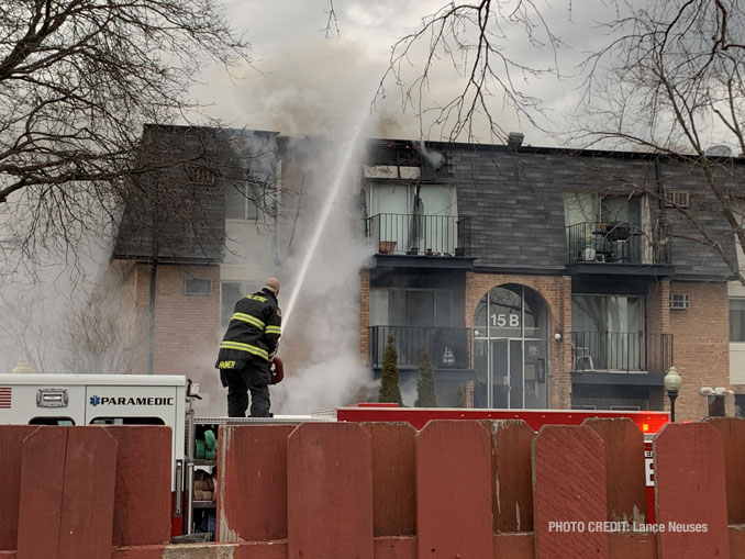 Deck gun at work at a fire scene at an apartment condo building on Dundee Quarter in Palatine (PHOTO CREDIT: Lance Neuses)